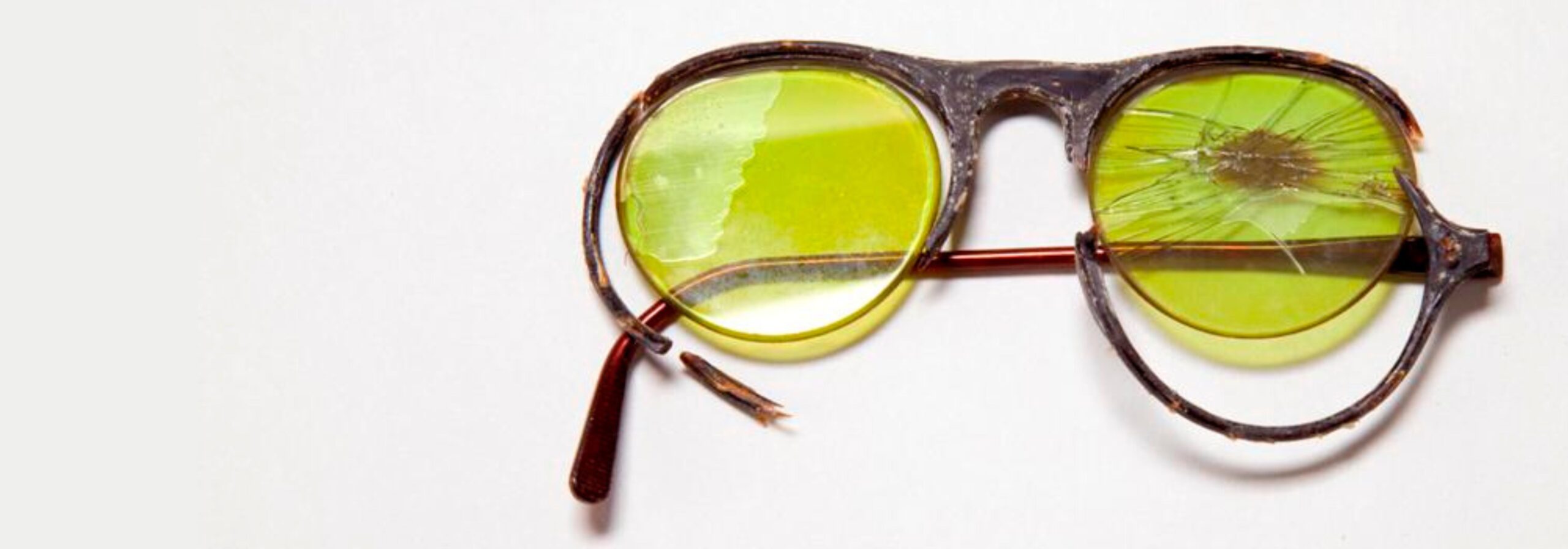 image of a broken pair of glasses promoting online exhibitions.